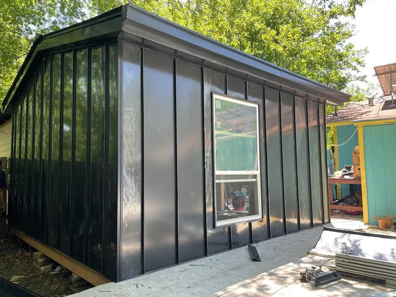 Black standing seam metal wall panels for Roof Inspection in Royalton